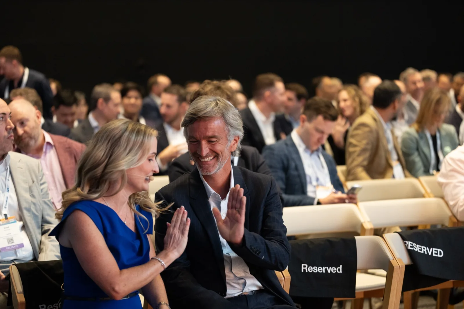 Delegates applauding at the close of a panel discussion