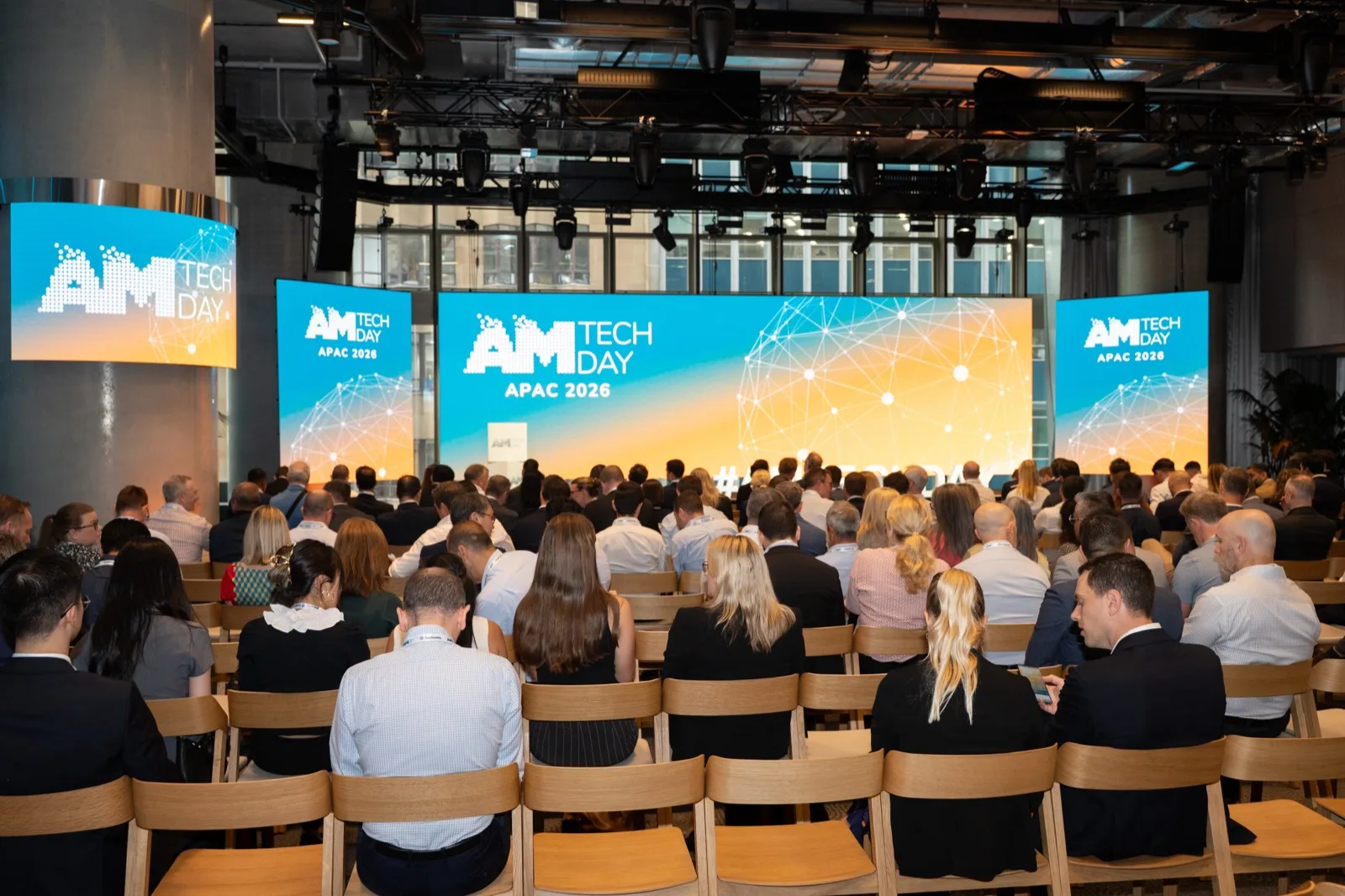 Delegates seated in the plenary room during a keynote session