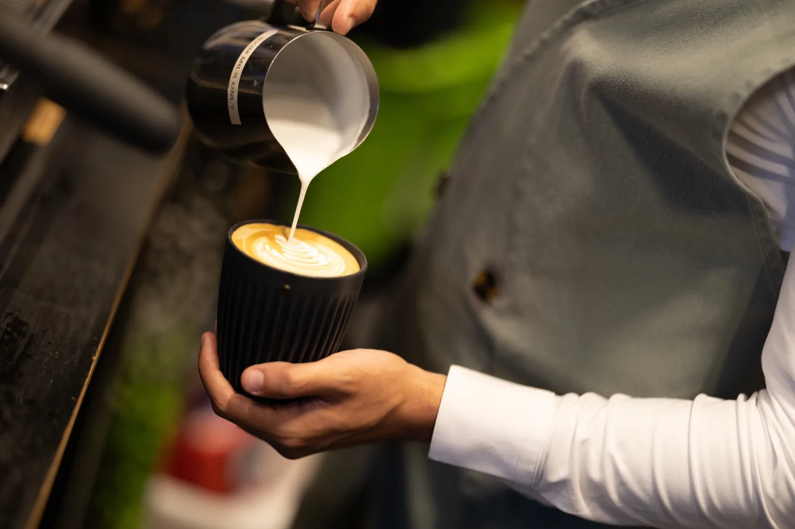 Barista preparing coffee for delegates during a break